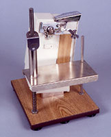 Photo of One Hand Can Opener on wooden platform