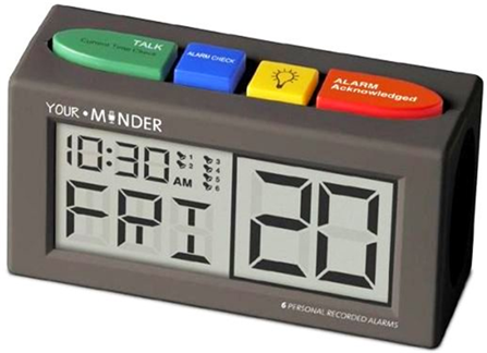 Title: A photo of the Recordable Talking Alarm Clock-Pill Reminder. - Description: The photo shows four brightly colored buttons atop the large display device.